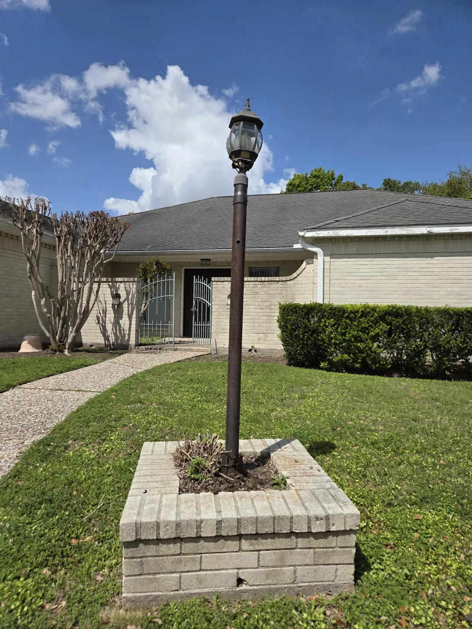 Landscape lamp post before Houston TX 77071